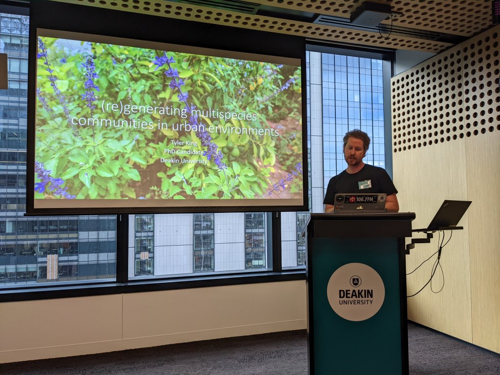 Tyler King presenting "(re)generating multispecies communities in urban environments" (Melbourne node)